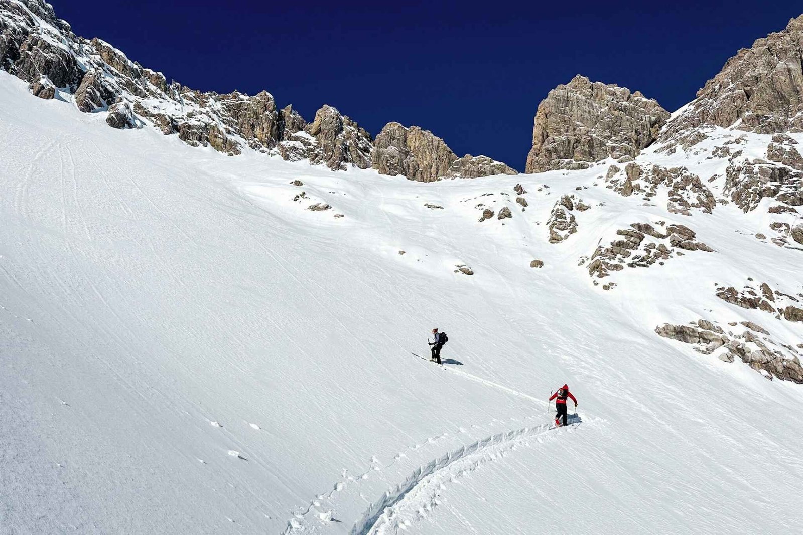 Ski tourers lay a ascent track on the Arlberg